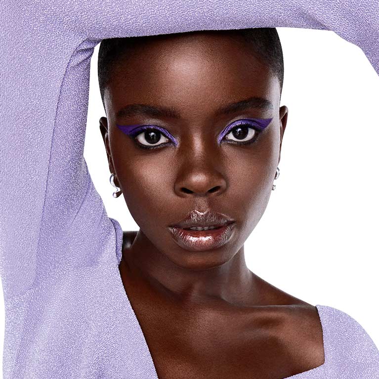 Joy Sunday in her Lancome purple makeup look by makeup artist Paul Blanch